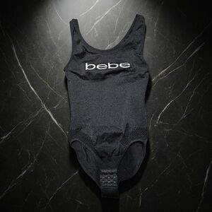 BEBE Black Bodysuit With bebe On Front. Very Cute! Size S. Excellent Condition!